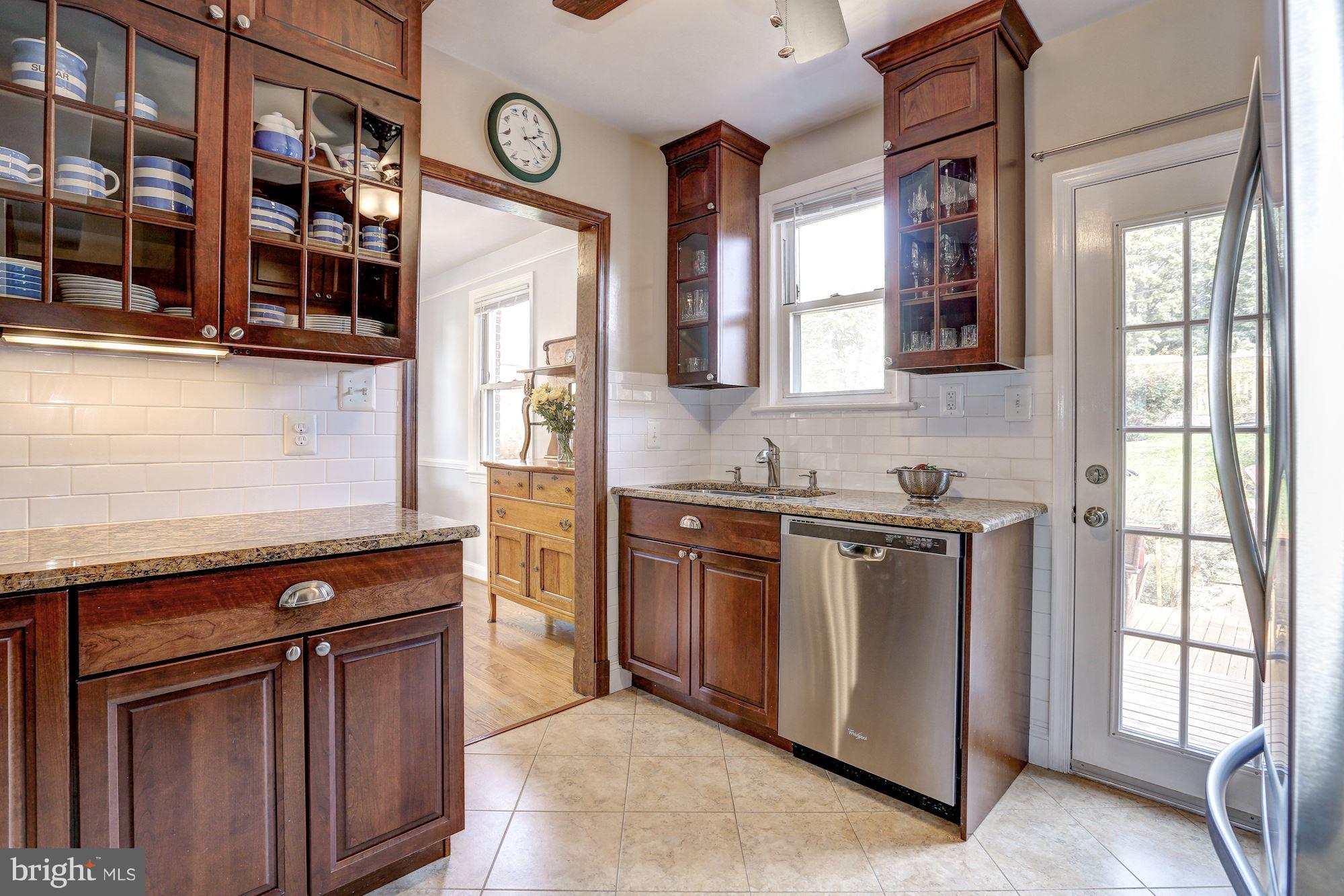 6513 3rd Street Northwest Washington, DC 20012 - Photo 11 of 30 a kitchen with stainless steel appliances granite countertop a stove and a sink