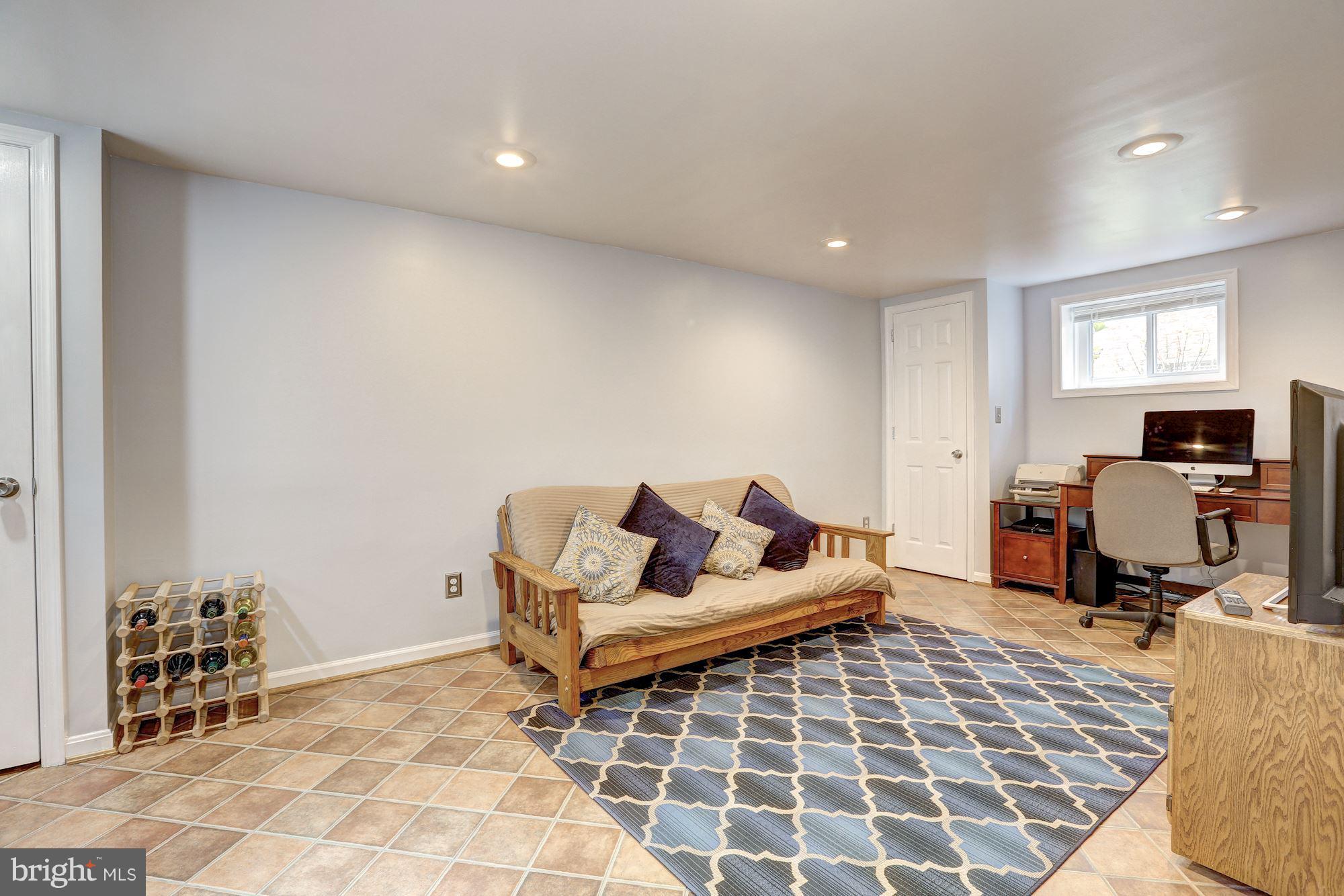 6513 3rd Street Northwest Washington, DC 20012 - Photo 19 of 30 a living room with furniture and a rug