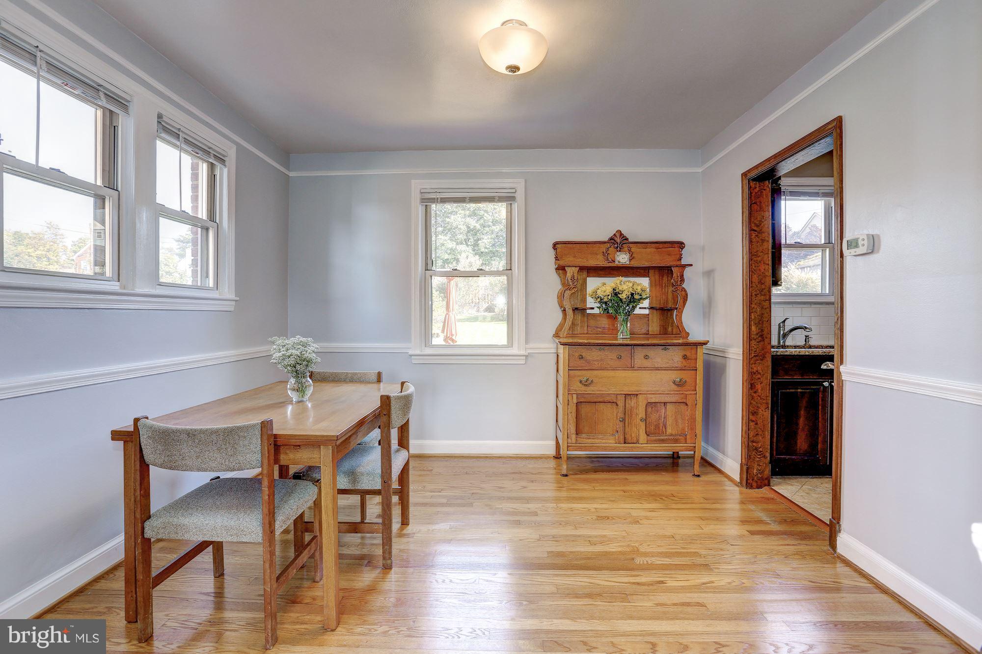 6513 3rd Street Northwest Washington, DC 20012 - Photo 7 of 30 a view of a dining room with furniture and wooden floor