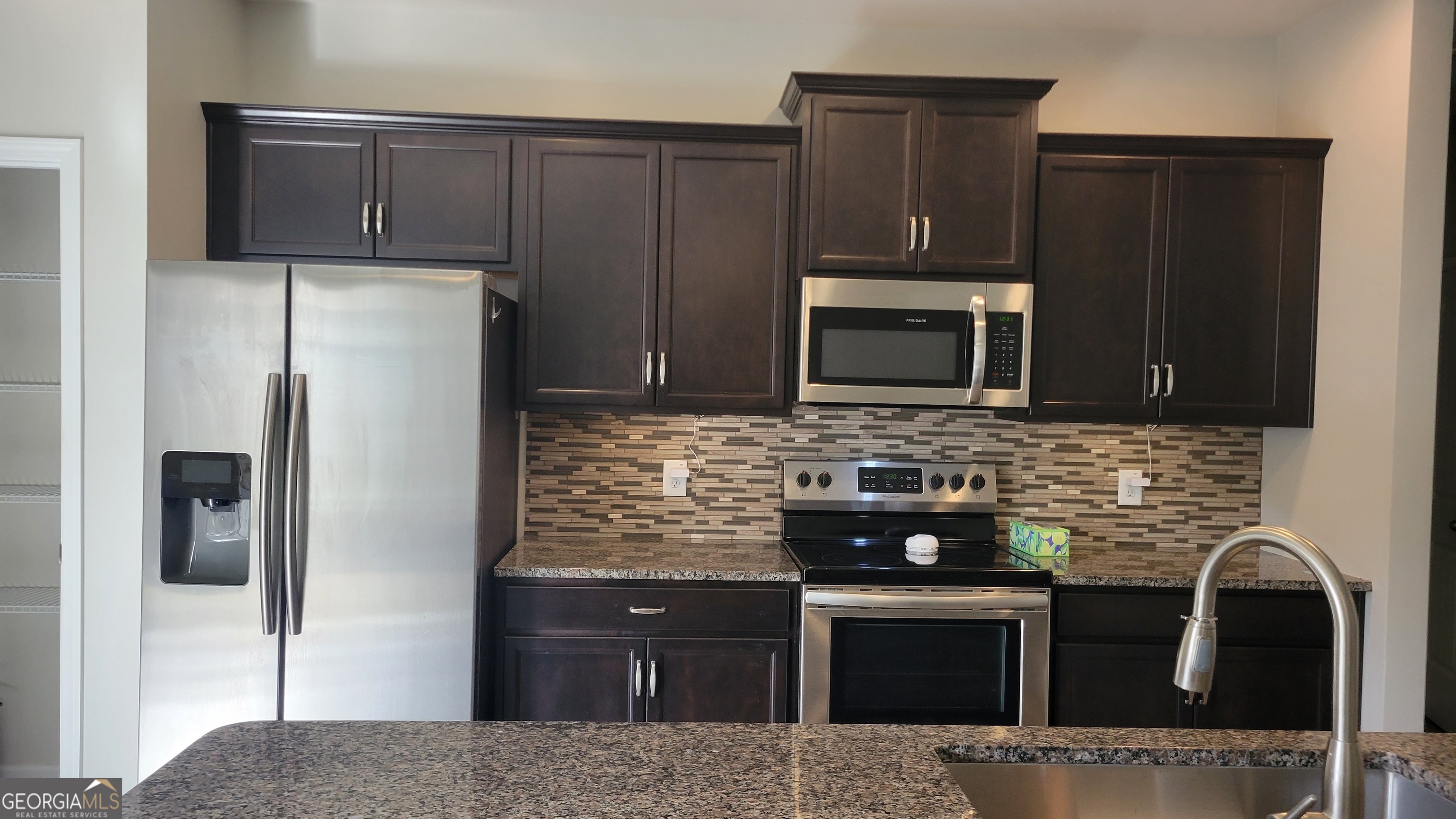 1 Berryrun Drive Rome, GA 30165 - Photo 12 of 23 a kitchen with a refrigerator stove and microwave