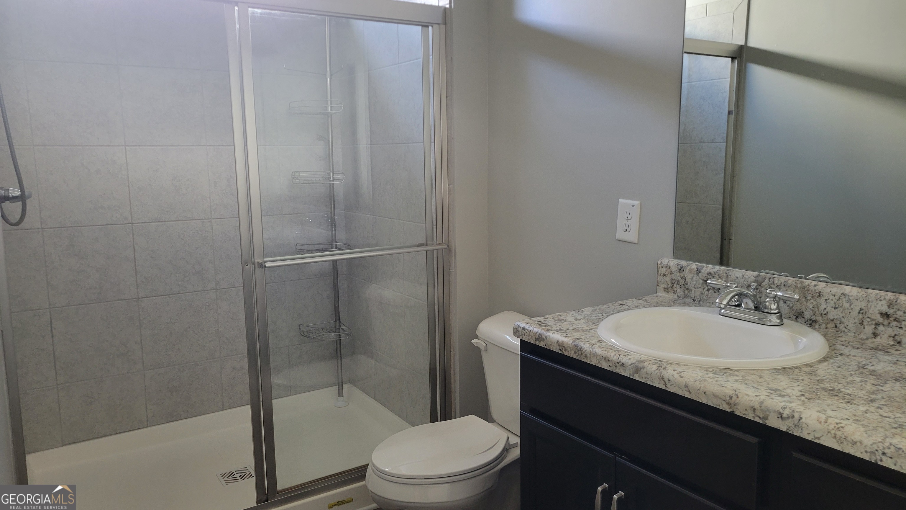 1 Berryrun Drive Rome, GA 30165 - Photo 18 of 23 a bathroom with a granite countertop sink toilet a mirror and shower
