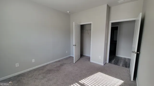 a view of a room with a hallway