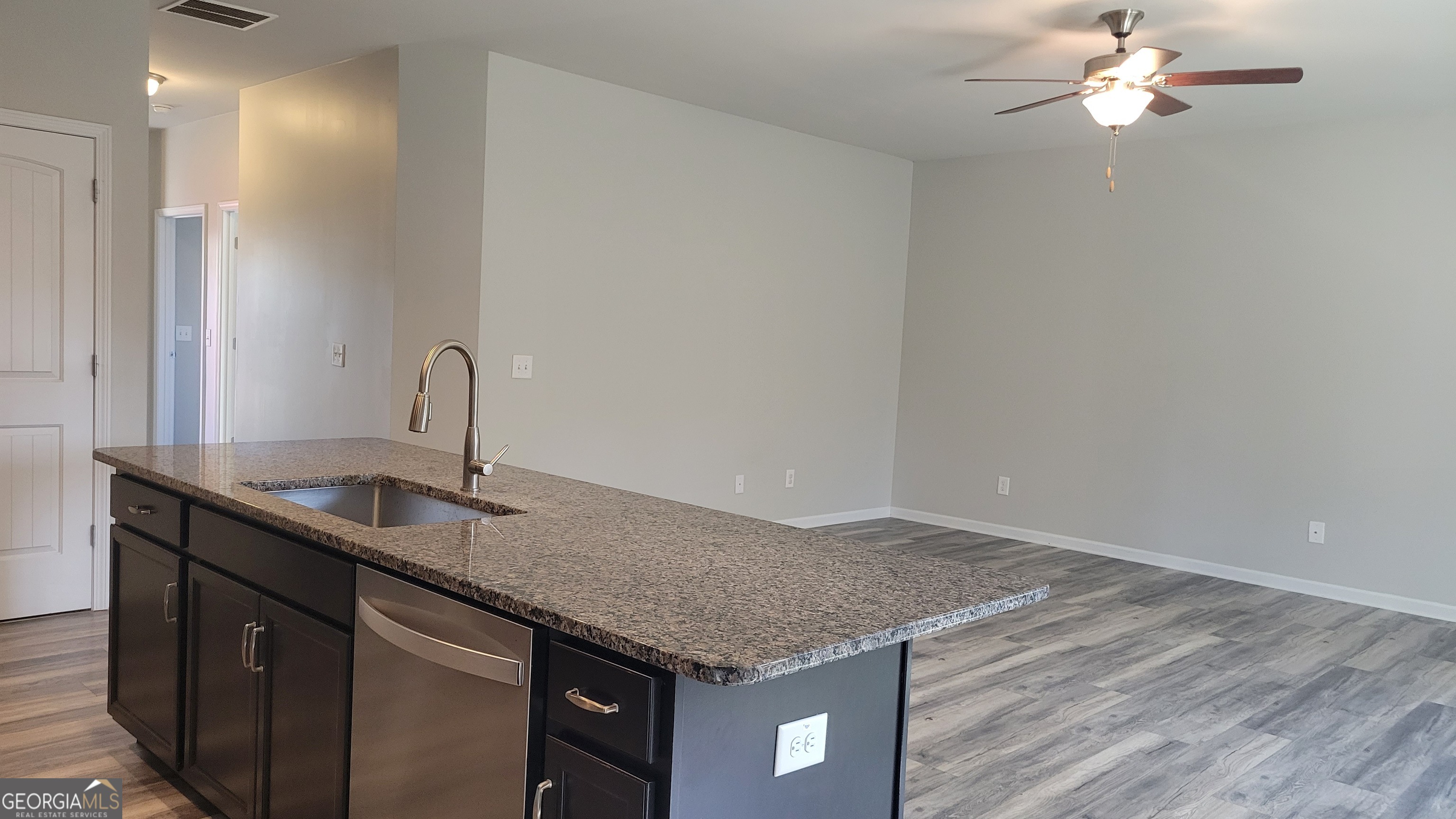 1 Berryrun Drive Rome, GA 30165 - Photo 10 of 23 a kitchen with a granite countertop sink and dishwasher