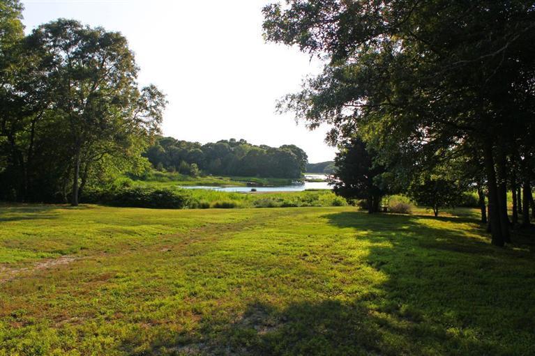 41 Depot Road Cataumet, MA 02534 - Photo 30 of 34 a view of a green field with wooden fence