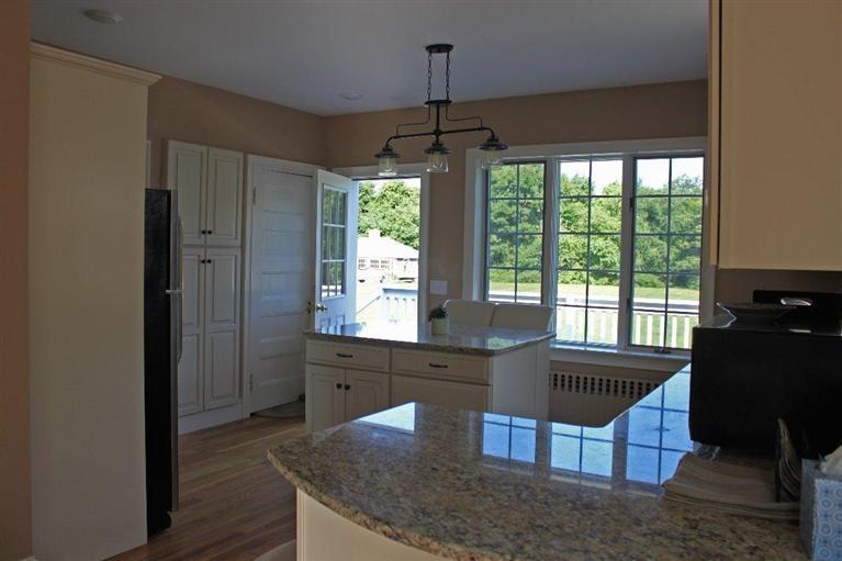 41 Depot Road Cataumet, MA 02534 - Photo 8 of 34 a kitchen with granite countertop a stove and a granite counter top