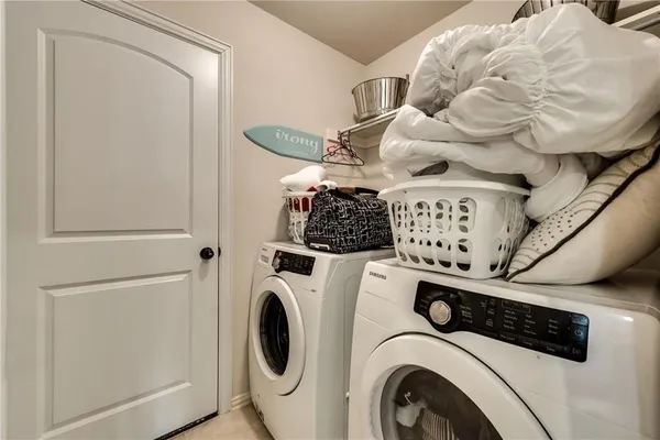 a utility room with dryer and washer