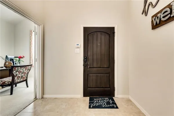 a view of room with a table and chairs