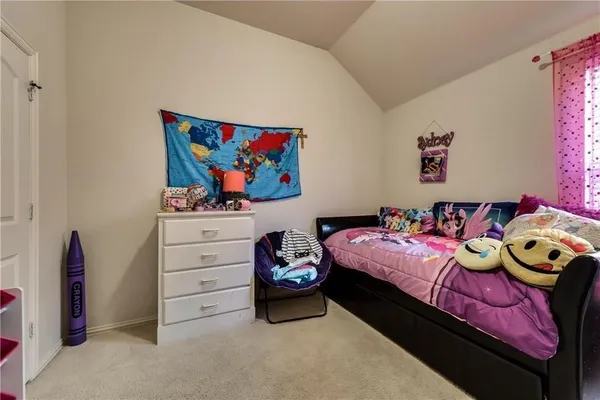 a bedroom with a bed and furniture