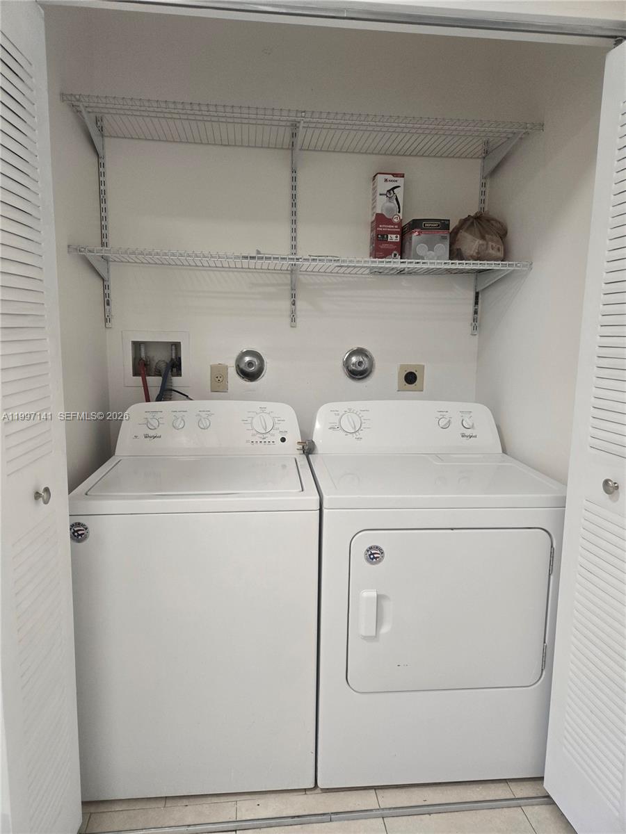 9740 Northwest 5th Avenue Miami, FL 33150 - Photo 11 of 18 a utility room with dryer and washer