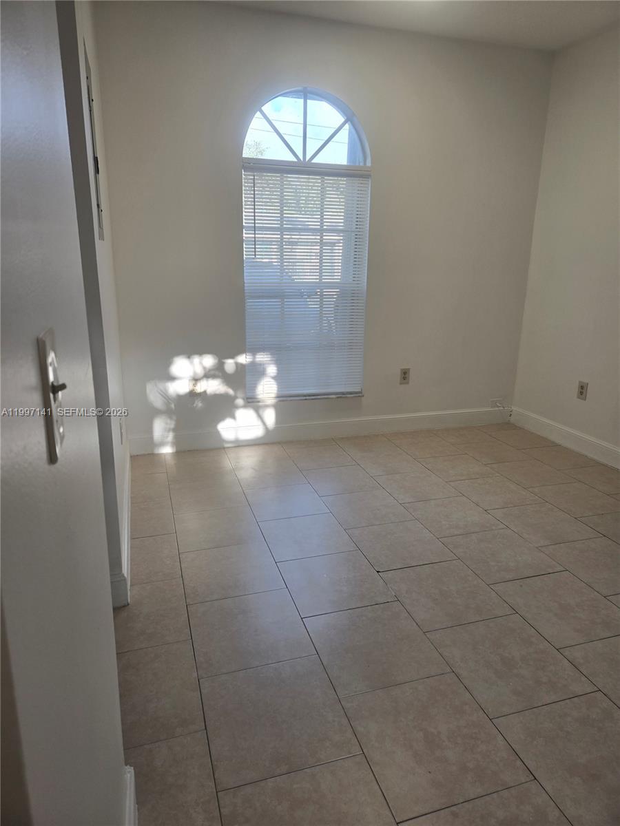 9740 Northwest 5th Avenue Miami, FL 33150 - Photo 12 of 18 en empty room with windows
