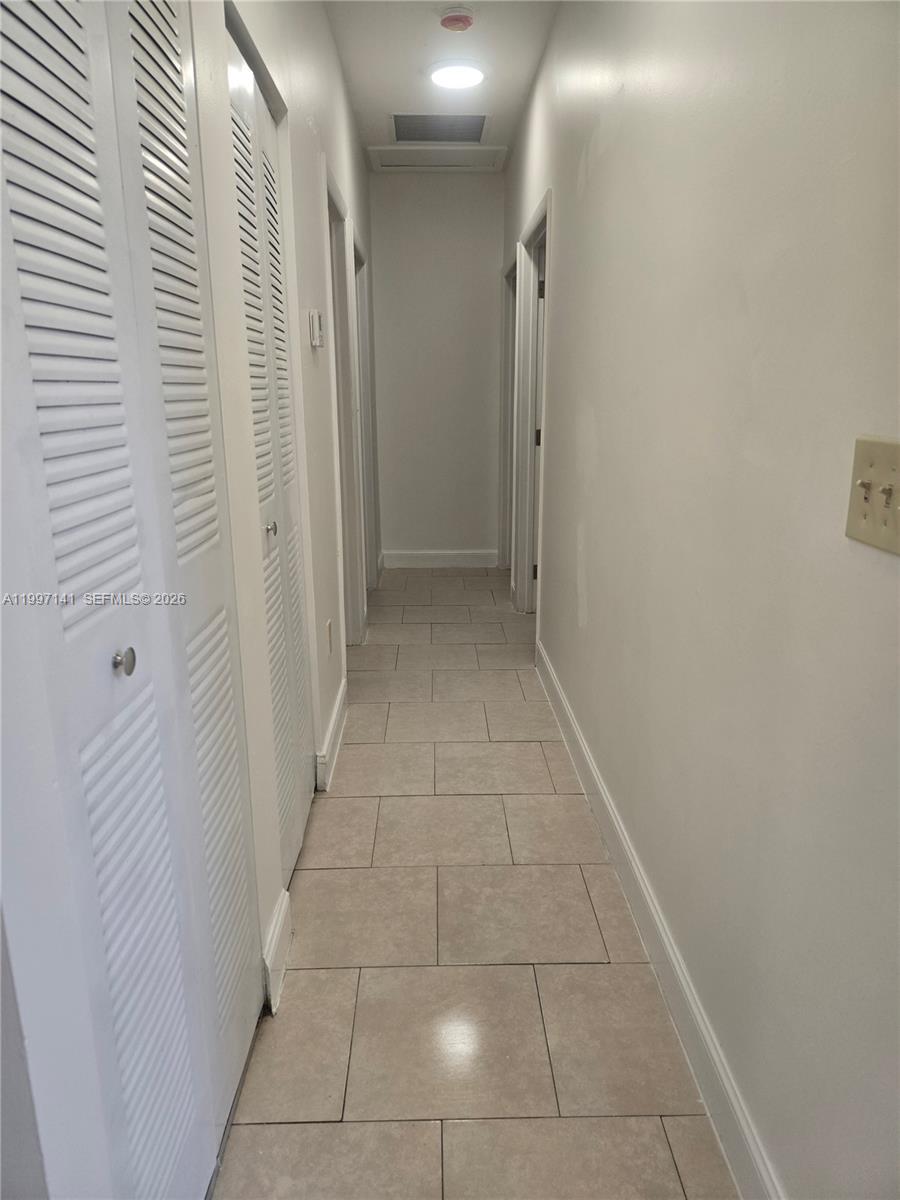 9740 Northwest 5th Avenue Miami, FL 33150 - Photo 13 of 18 a view of hallway with a mirror