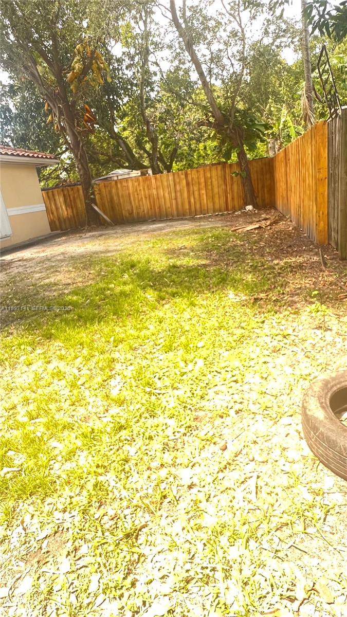 9740 Northwest 5th Avenue Miami, FL 33150 - Photo 18 of 18 a view of a swimming pool with an outdoor space and seating area