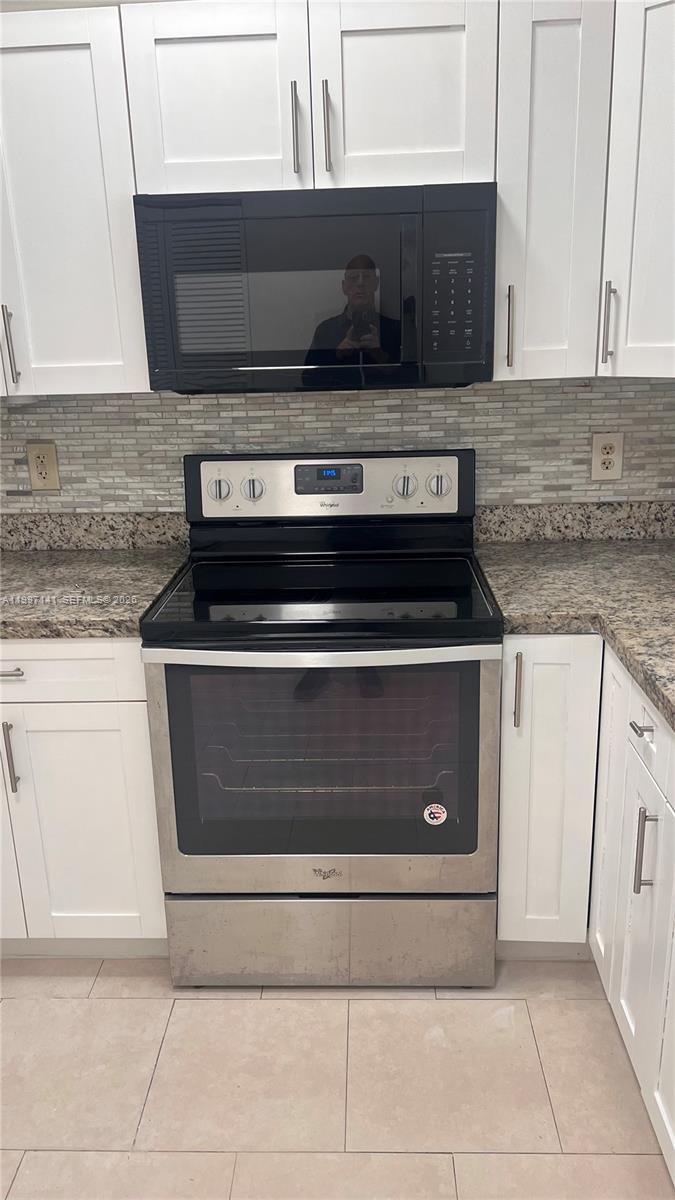 9740 Northwest 5th Avenue Miami, FL 33150 - Photo 3 of 18 a stove top oven sitting inside of a kitchen