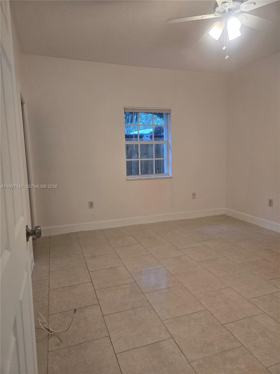 9740 Northwest 5th Avenue Miami, FL 33150 - Photo 10 of 18 an empty room with a window