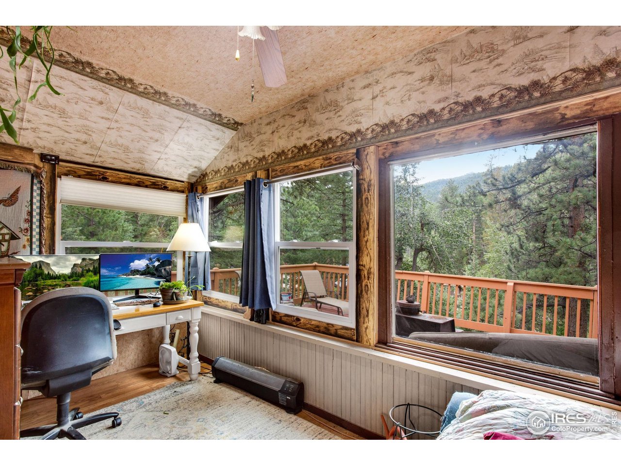 2248 Riverside Drive Lyons, CO 80540 - Photo 17 of 28 a room with furniture and a large window