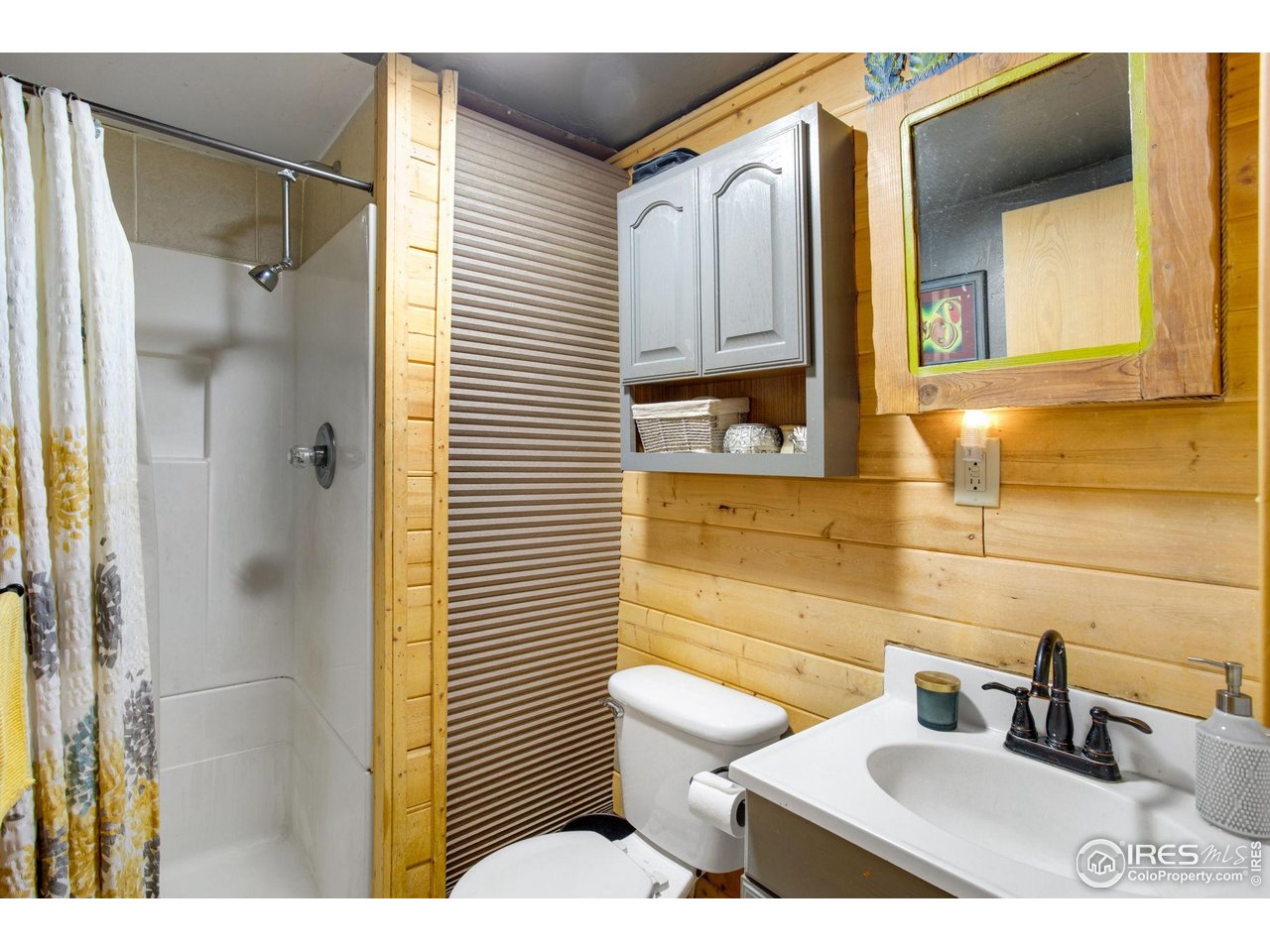 2248 Riverside Drive Lyons, CO 80540 - Photo 20 of 28 a bathroom with a sink a toilet and shower