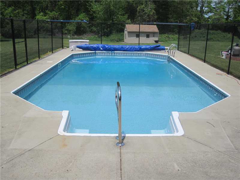 46 Rhodes Street Cumberland, RI 02864 - Photo 5 of 25 Swimming Pool/Hot Tub/Sauna. Fenced in ground pool with a solar cover.