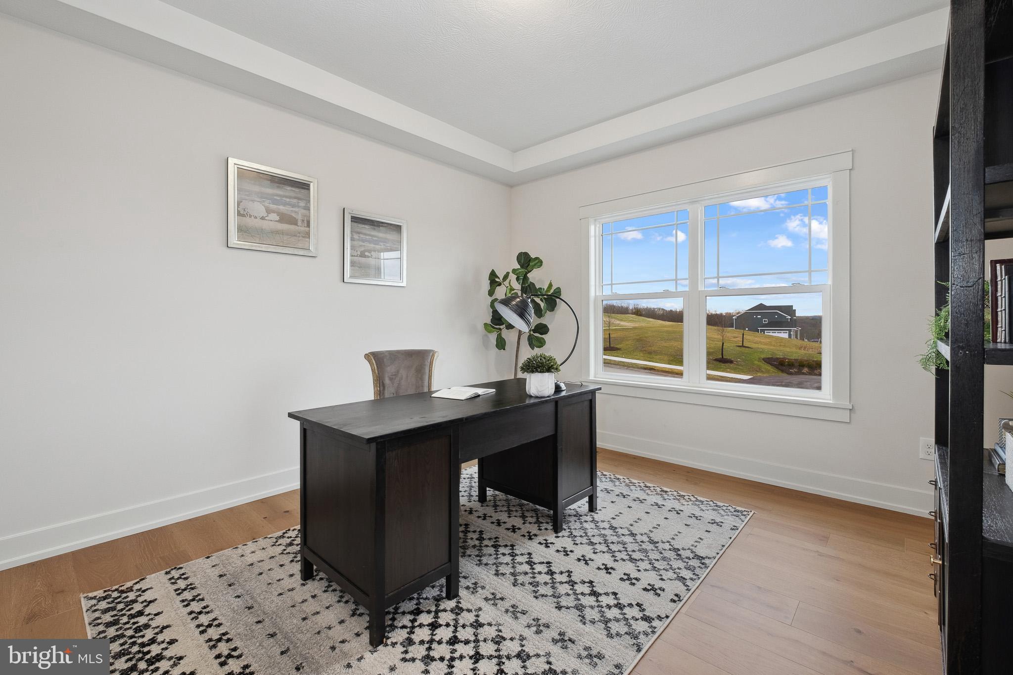 510 Newcomen Road, Unit M1D Exton, PA 19341 - Photo 9 of 34 a view of a workspace with furniture and a window