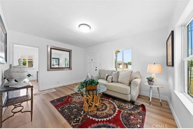 a living room with furniture and a rug