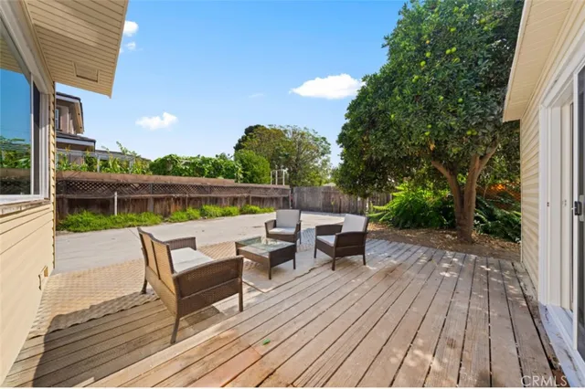 a view of house with outdoor seating and city view