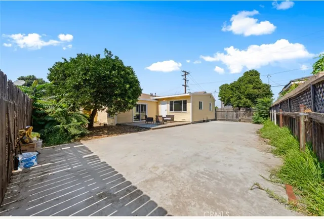 a front view of a house with a yard and a garage