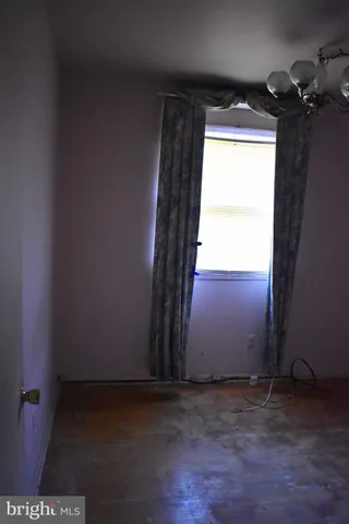 a view of an empty room and a window