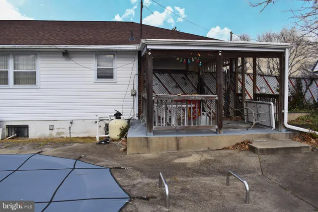 a view of a white house with a yard