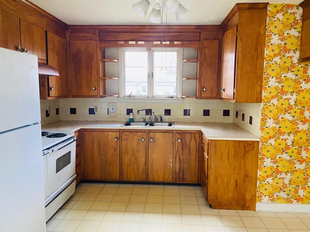 191 Mohawk Road Somerset, MA 02726 - Photo 8 of 19 a kitchen with stainless steel appliances a refrigerator sink and cabinets