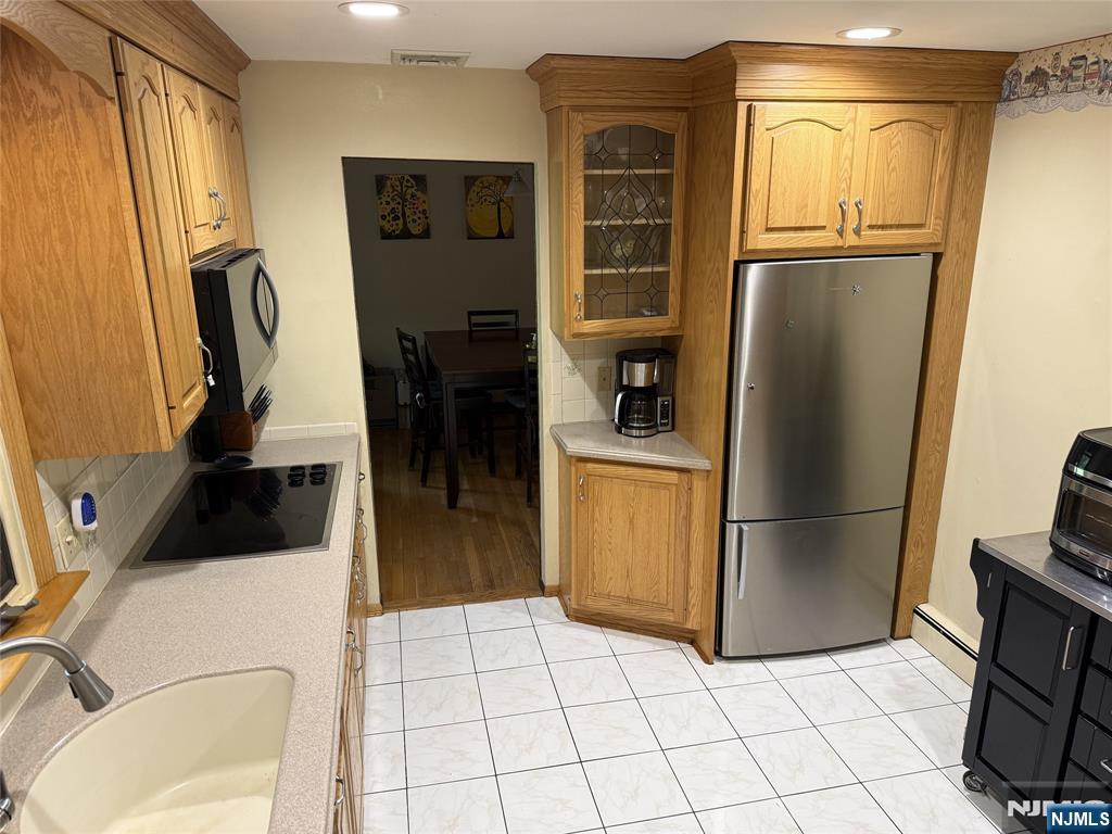 36 Lavina Trail Oak Ridge, NJ 07438 - Photo 12 of 26 a kitchen with stainless steel appliances a refrigerator and a sink
