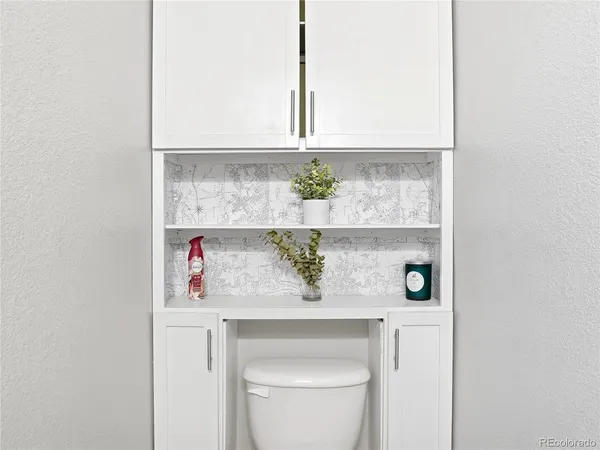 a view of bathroom with a sink and a window