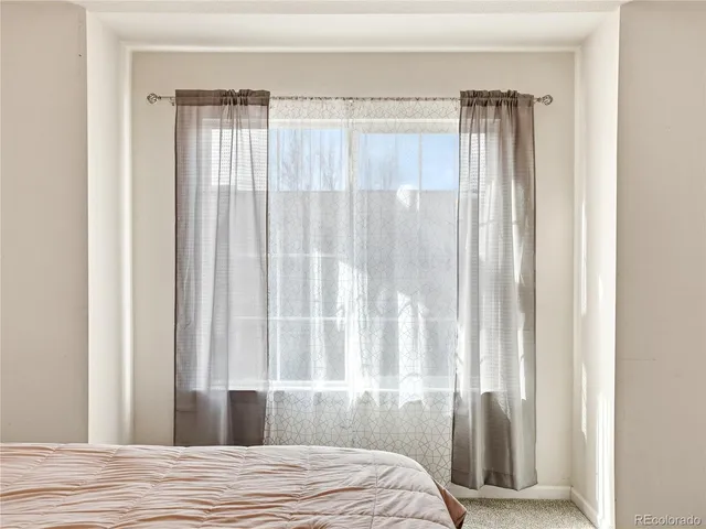 a bathroom with a granite countertop sink toilet a shower and a mirror
