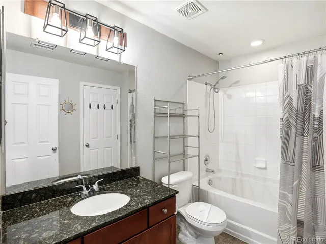 a view of a hallway with wooden shelves