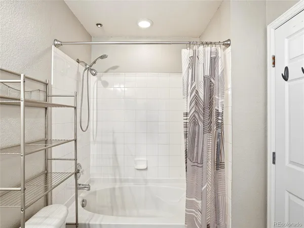 a view of a livingroom with an empty space and a window