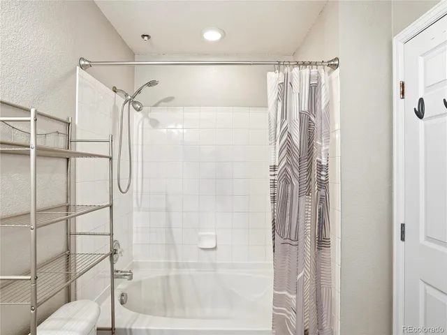 a view of a livingroom with an empty space and a window