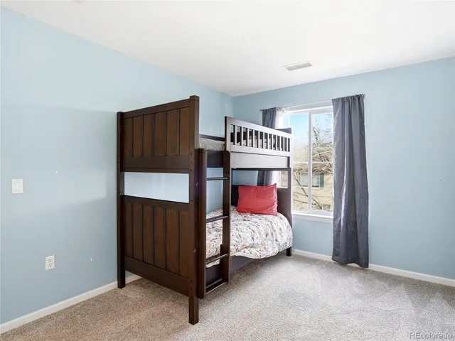 a view of hallway with wooden floor