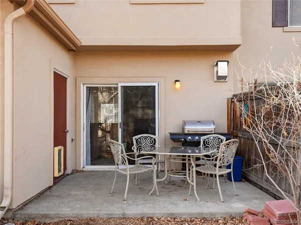 a view of a house with a yard covered in snow