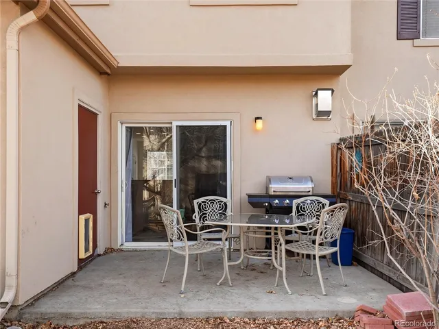 a view of a house with a yard covered in snow