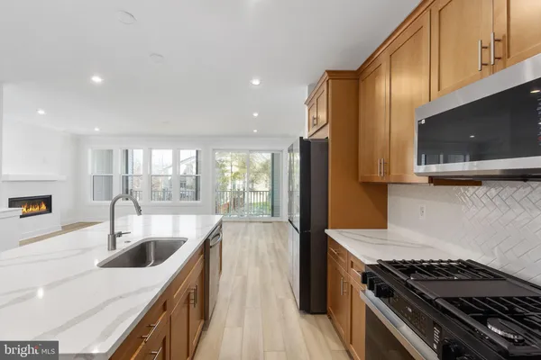 a bathroom with a sink vanity mirror and toilet