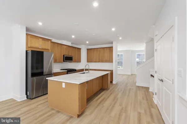 a view of a kitchen from the hallway