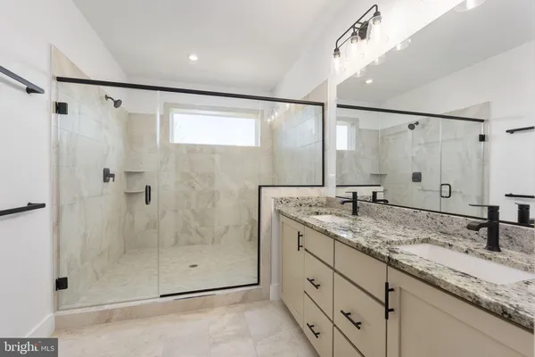 a kitchen with a sink a counter top space stainless steel appliances and cabinets
