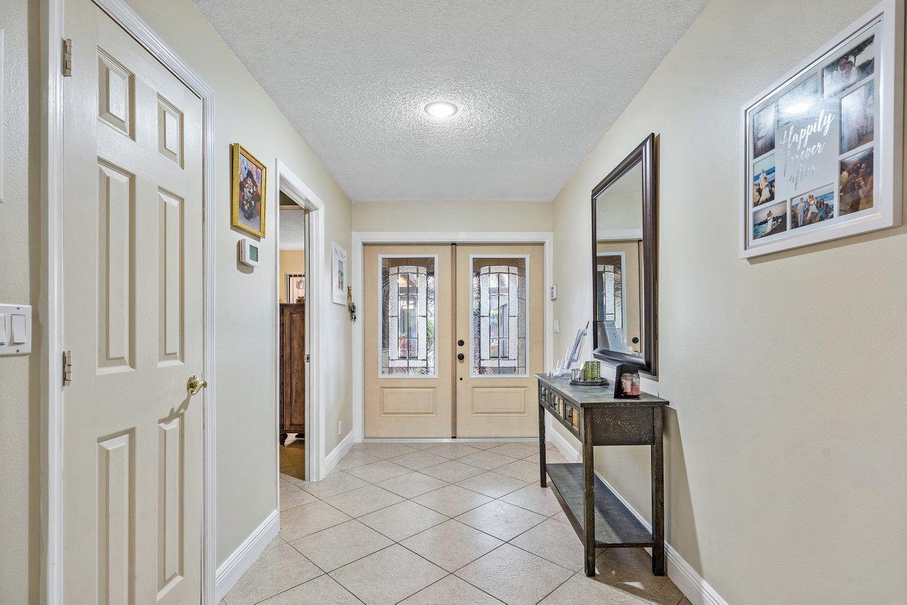 6850 Northwest 2nd Avenue, Unit 31 Boca Raton, FL 33487 - Photo 7 of 33 Foyer/New Impact Doors
