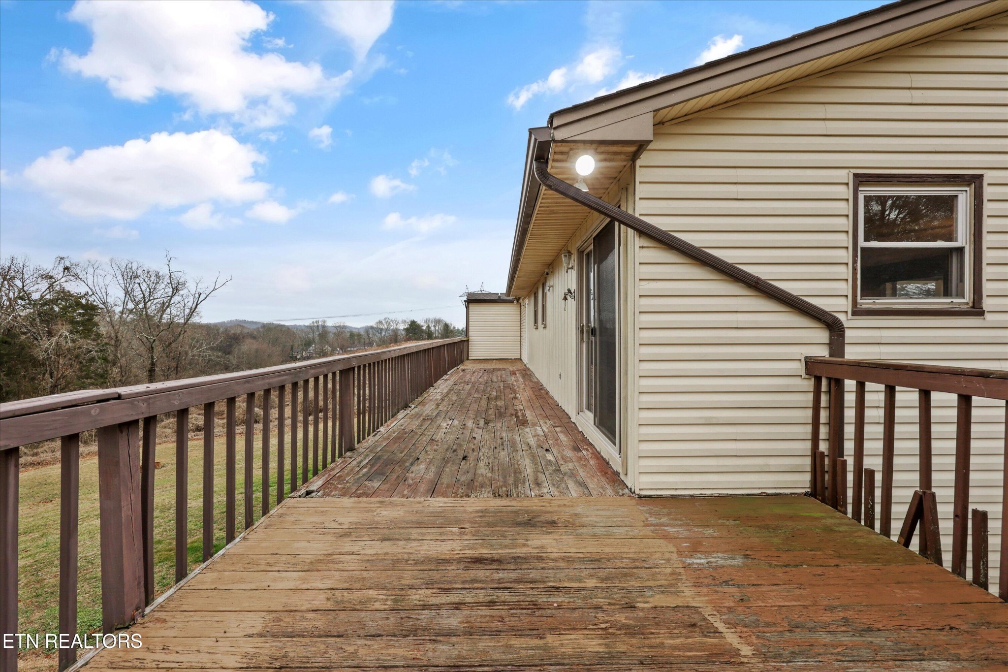 47 Paint Rock Ferry Road Kingston, TN 37763 - Photo 25 of 38 a view of a balcony with wooden floor and fence