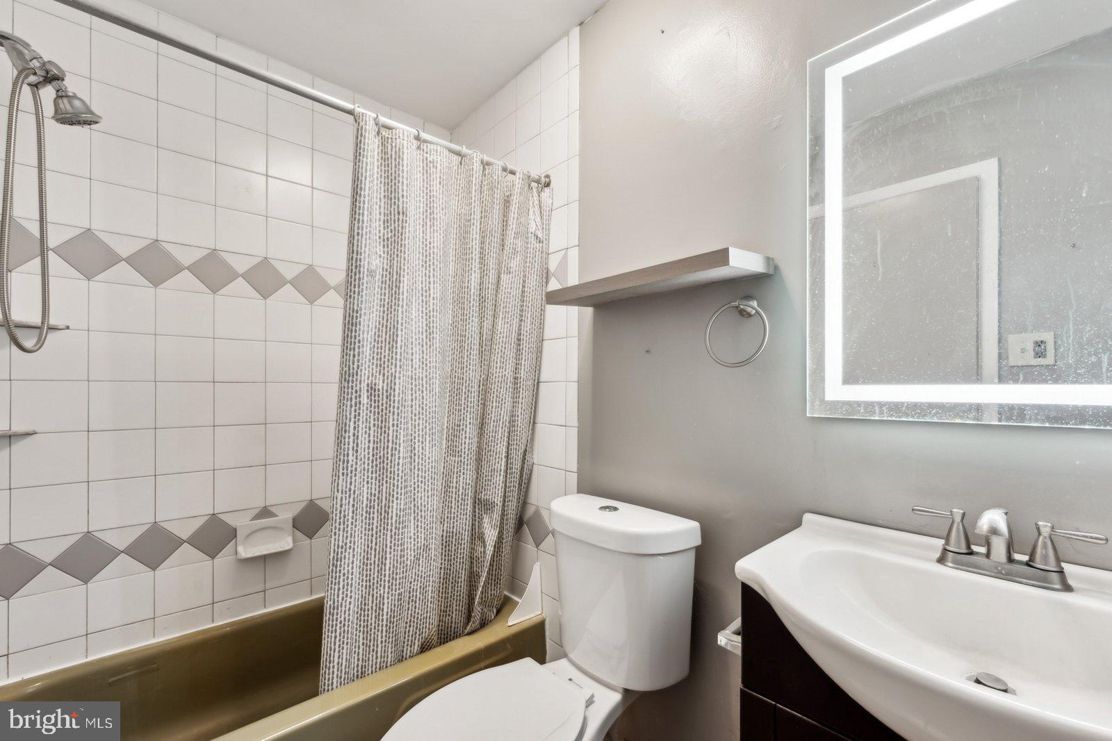 1004 Timber Creek Road Clementon, NJ 08021 - Photo 17 of 24 a bathroom with a sink a toilet and shower