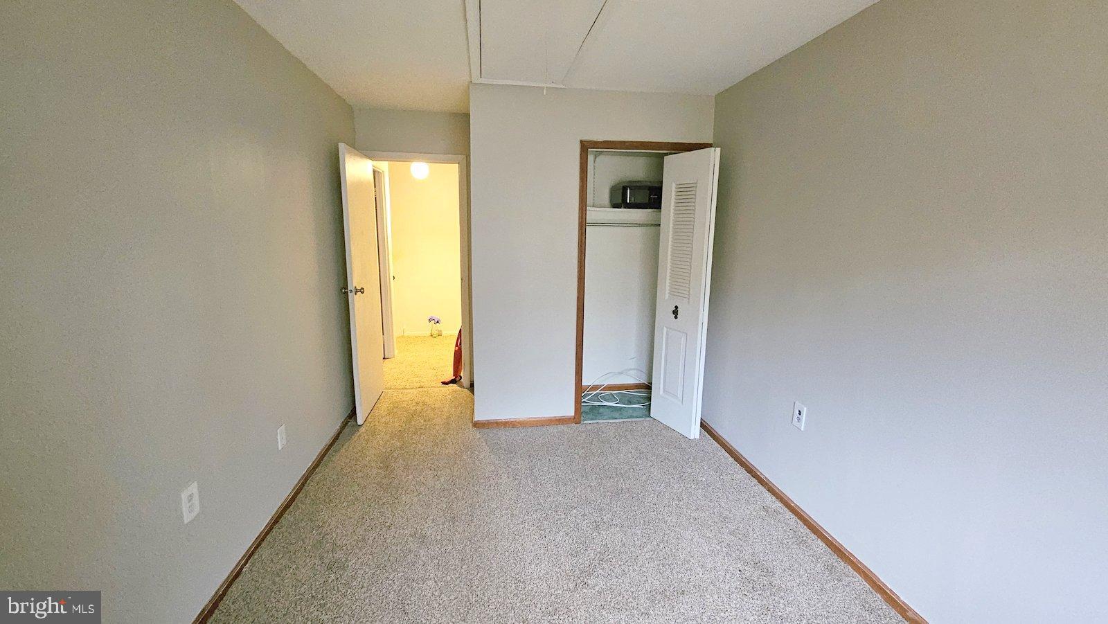 1004 Timber Creek Road Clementon, NJ 08021 - Photo 19 of 24 a view of an empty room with wooden floor and a window