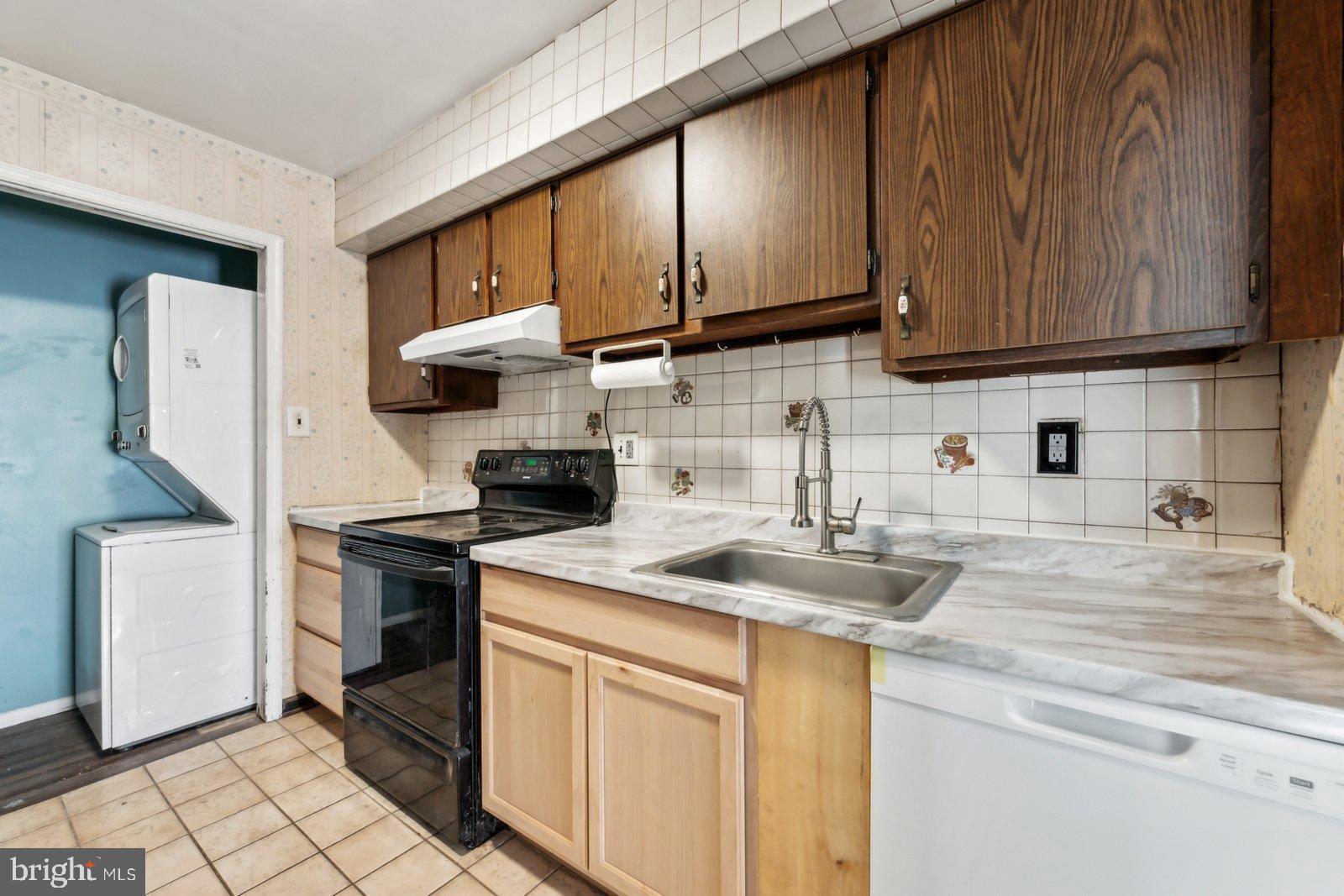 1004 Timber Creek Road Clementon, NJ 08021 - Photo 3 of 24 a kitchen with stainless steel appliances granite countertop a sink stove and refrigerator