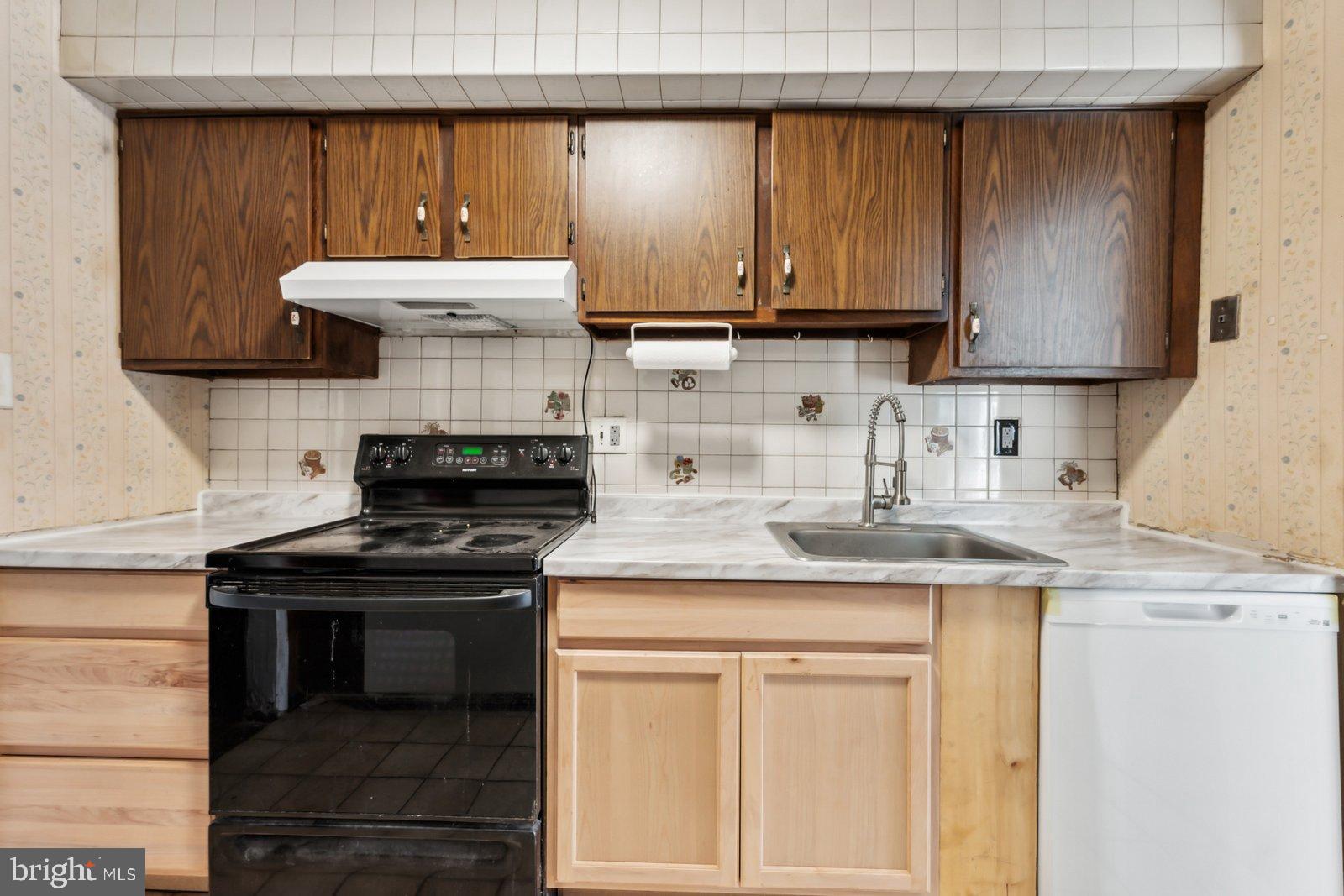 1004 Timber Creek Road Clementon, NJ 08021 - Photo 4 of 24 a kitchen with a stove and a sink