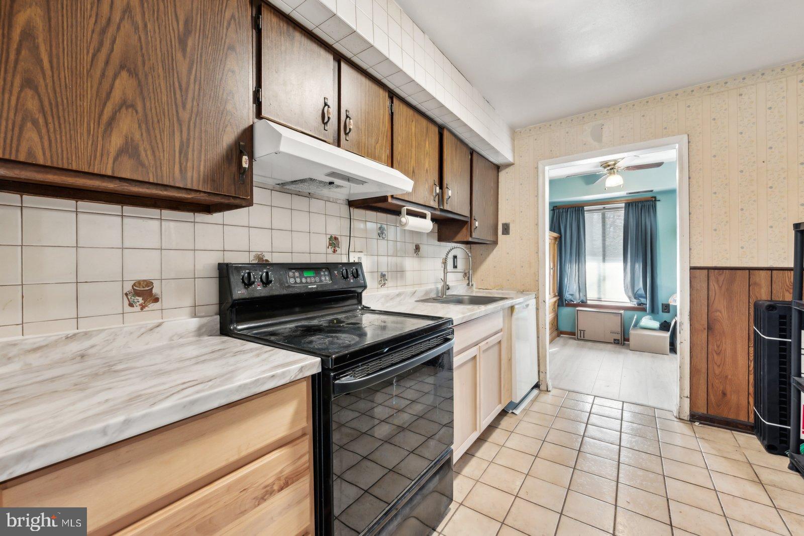 1004 Timber Creek Road Clementon, NJ 08021 - Photo 5 of 24 a kitchen with stainless steel appliances granite countertop a stove a sink and a microwave