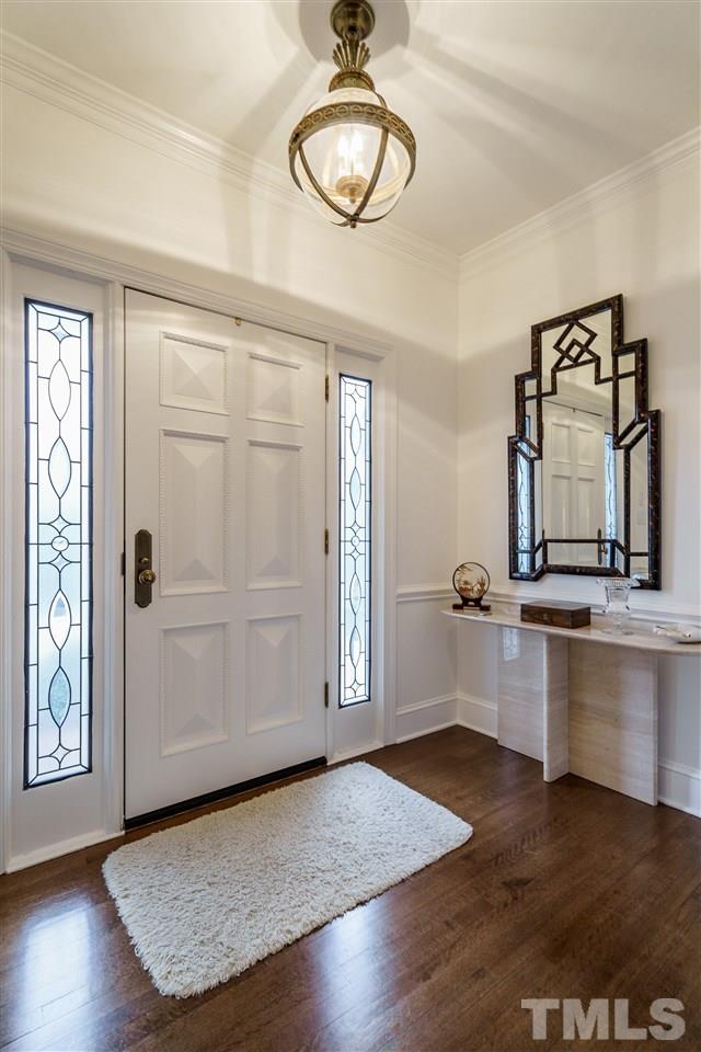 8509 Riddle Place Raleigh, NC 27615 - Photo 2 of 30 a view of a room with wooden floor and window