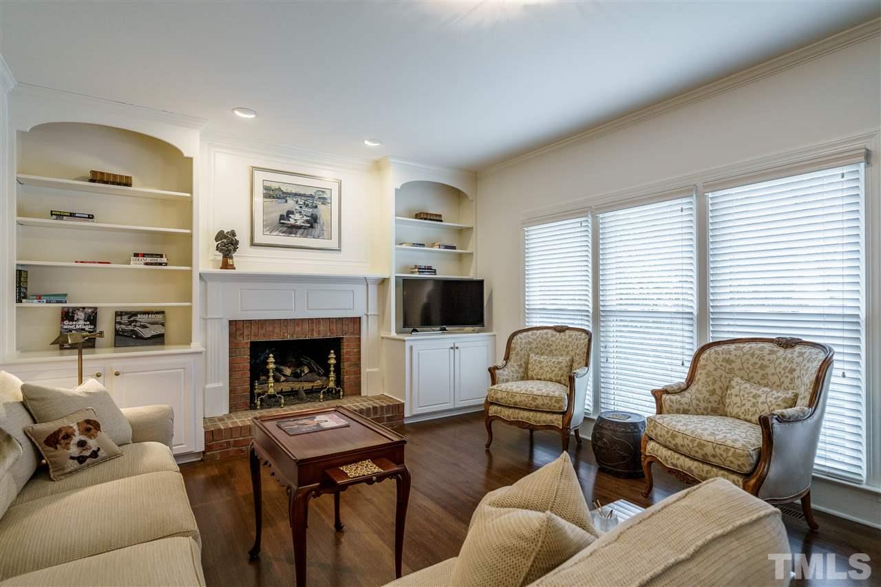 8509 Riddle Place Raleigh, NC 27615 - Photo 15 of 30 a living room with furniture and a fireplace