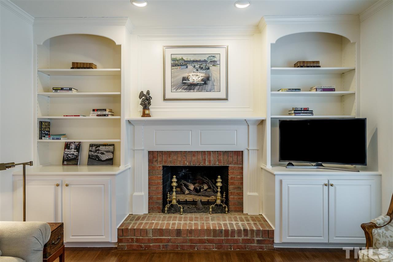 8509 Riddle Place Raleigh, NC 27615 - Photo 16 of 30 a living room with furniture and a fireplace